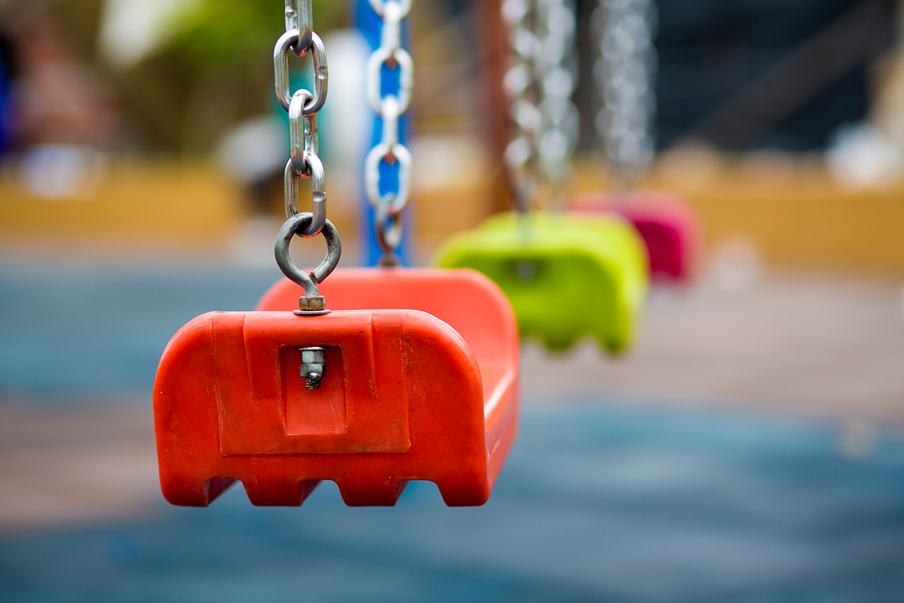 Close-up-of-empty-swing-in-a-playground